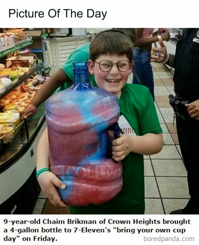 Young boy in a green shirt holding an oversized colorful bottle, capturing the spirit of random memes and unfiltered fun.