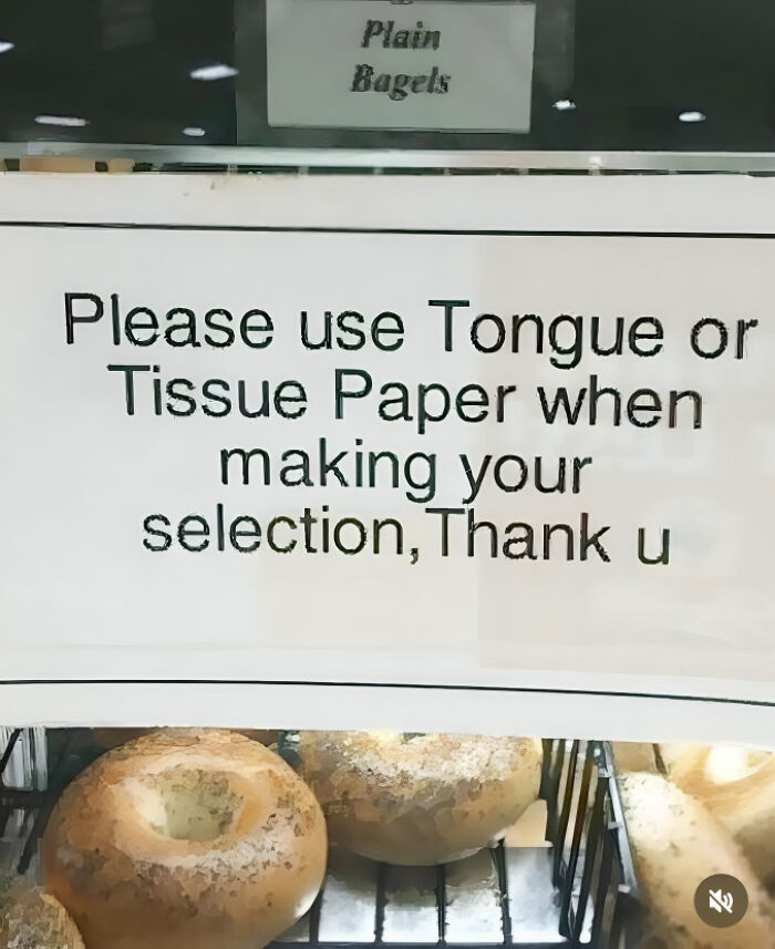 Sign with a typo humorously asking to use tongue or tissue paper when selecting bagels, showcasing funny typos content.