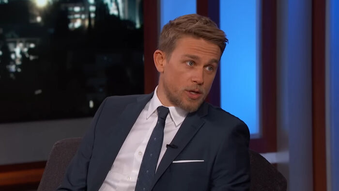 Male celebrity in a dark suit speaking during a late night show, illustrating celebrities Hollywood tried to make leading A-listers.