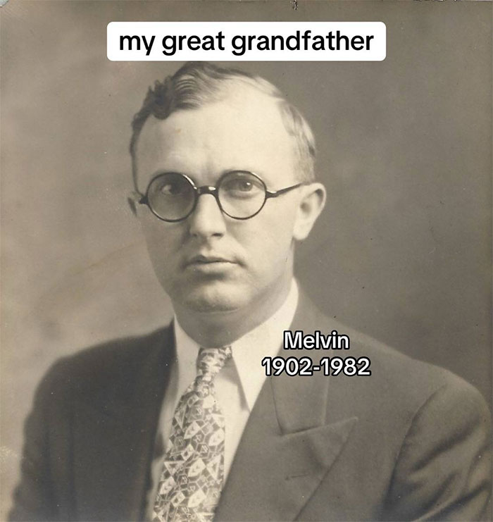 Black and white portrait of a man in glasses and suit representing a family historian sharing family tree stories online.
