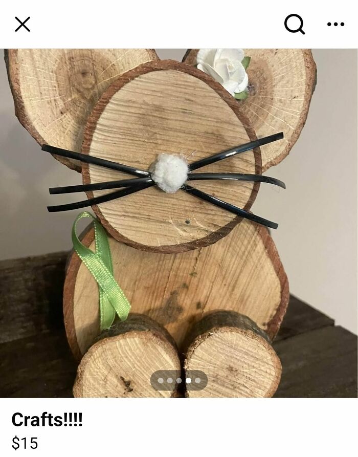 Wooden DIY craft project shaped like a mouse with black whiskers and a green ribbon, part of craft shaming collection.