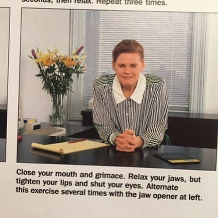 Person sitting at desk with a focused expression, demonstrating a jaw exercise found in a bizarre thrift store item.
