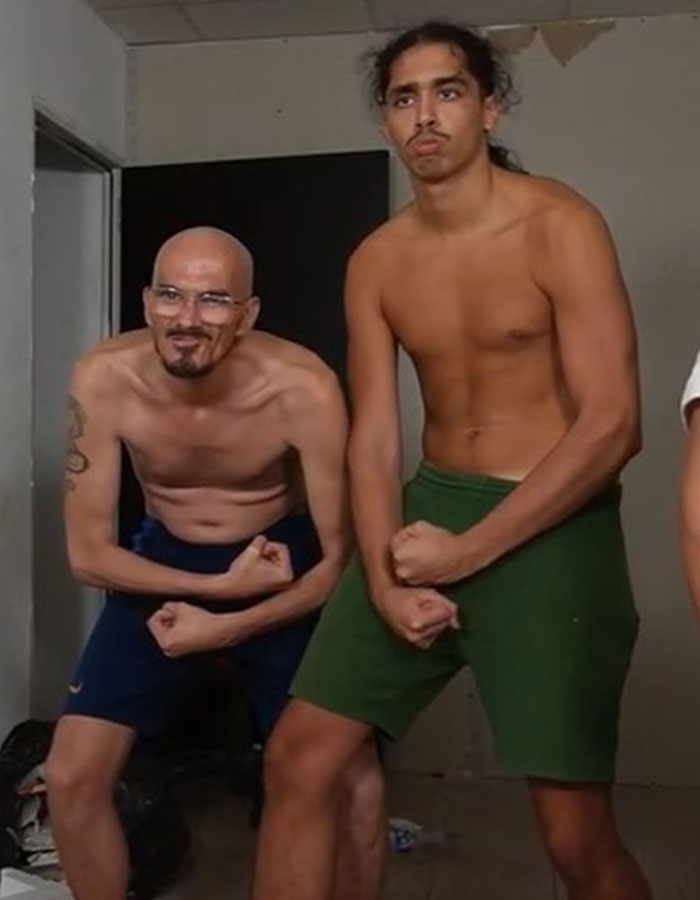 Two shirtless men posing and flexing muscles indoors, related to the streamer's passing and his family's reaction. Two shirtless men posing and flexing muscles indoors, related to the streamer's passing and his family's reaction.