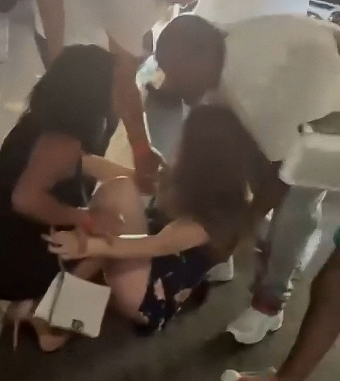 Single mom injured by Cincinnati mob being helped by bystanders in a chaotic public setting. Single mom injured by Cincinnati mob being helped by bystanders in a chaotic public setting.