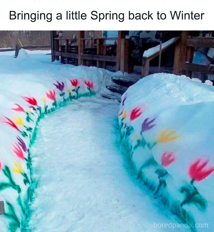 Snow-covered walkway with colorful painted flowers on snowbanks, showcasing ingenious crafty ideas for outdoor decoration.