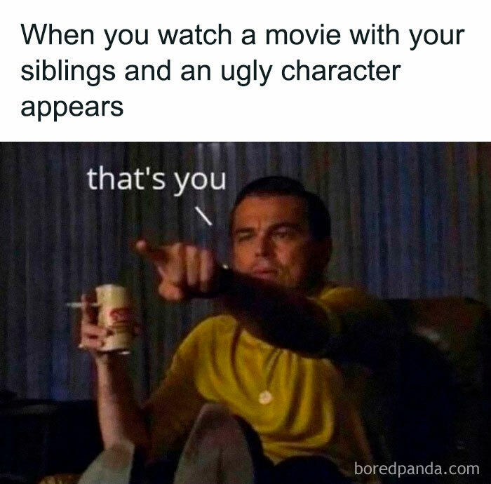 Man pointing at TV screen holding a drink, illustrating a hilarious relatable friendship meme about ugly characters in movies.