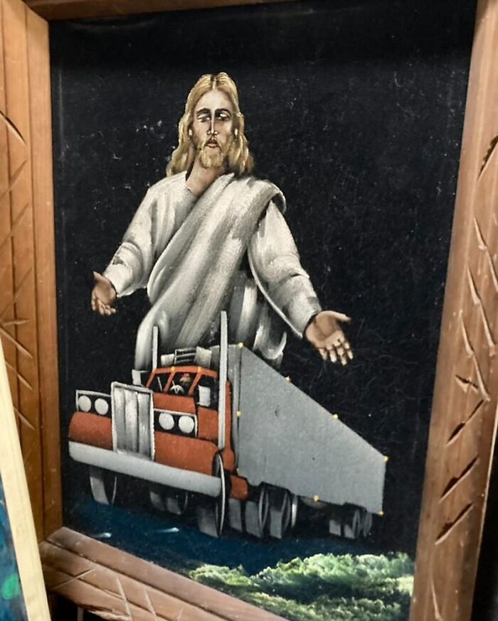 Painting found at a thrift store featuring a surreal image of Jesus standing over a large red truck with outstretched arms.