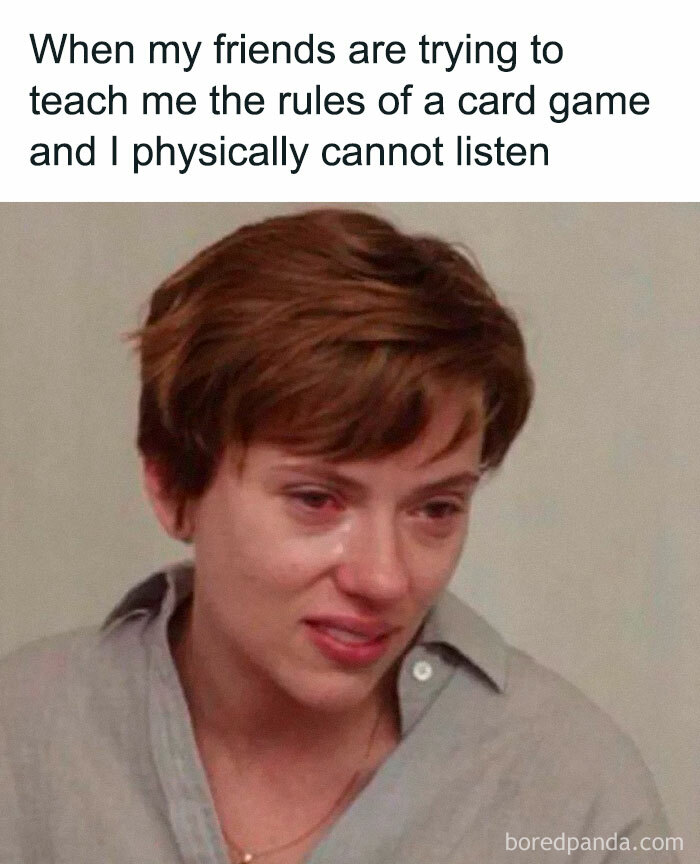 Person with short brown hair looking overwhelmed with red eyes and a caption about not listening, representing introvert-worthy memes.