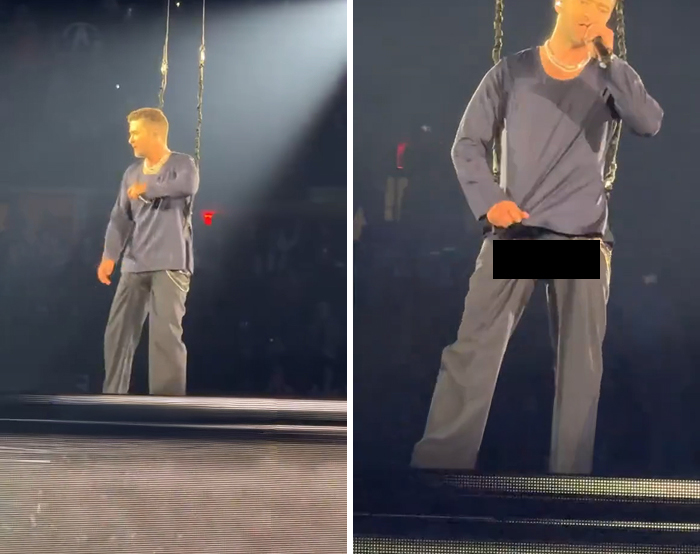 Male singer performing on stage experiencing a celebrity wardrobe malfunction during a live concert event.