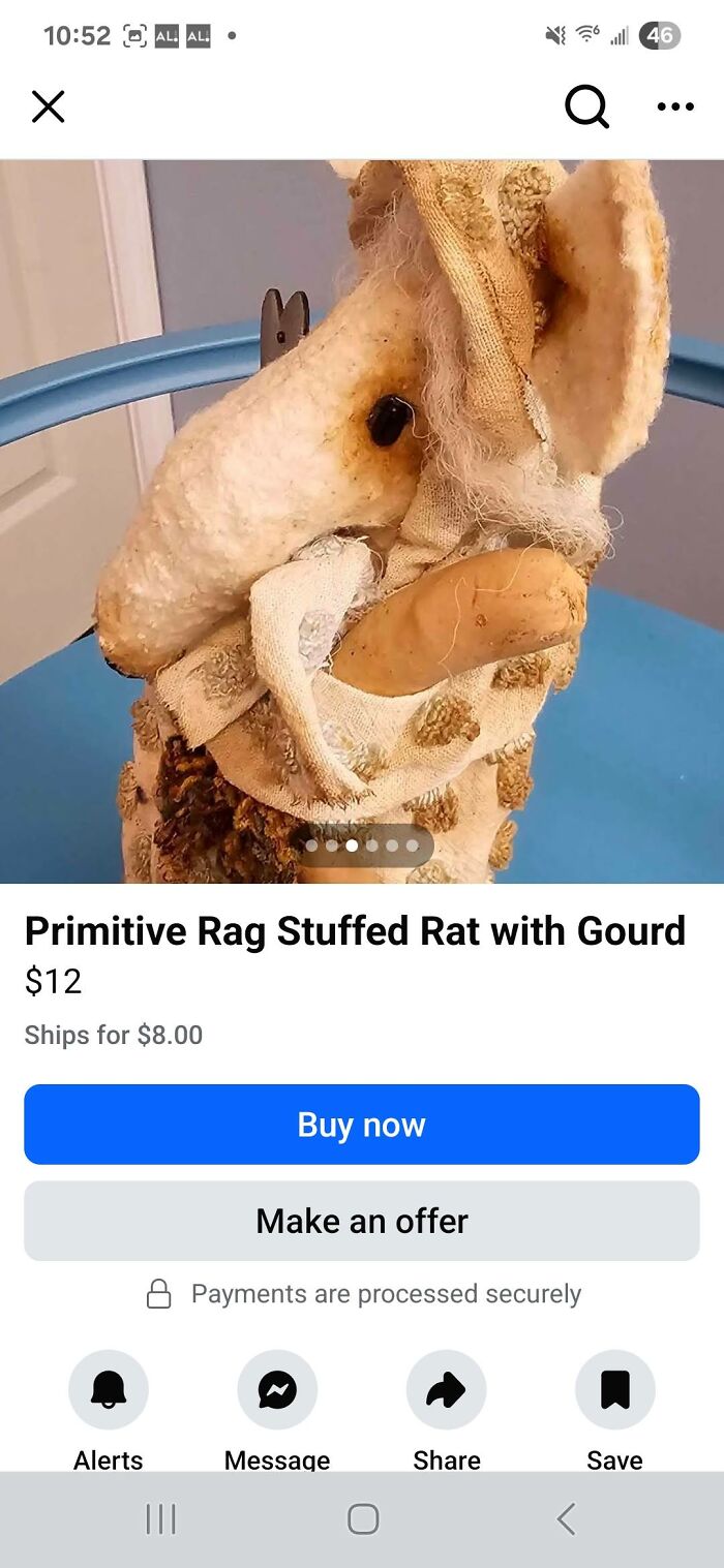 Primitive rag stuffed rat craft project with gourd displayed on blue chair highlighting DIY crafting flaws.
