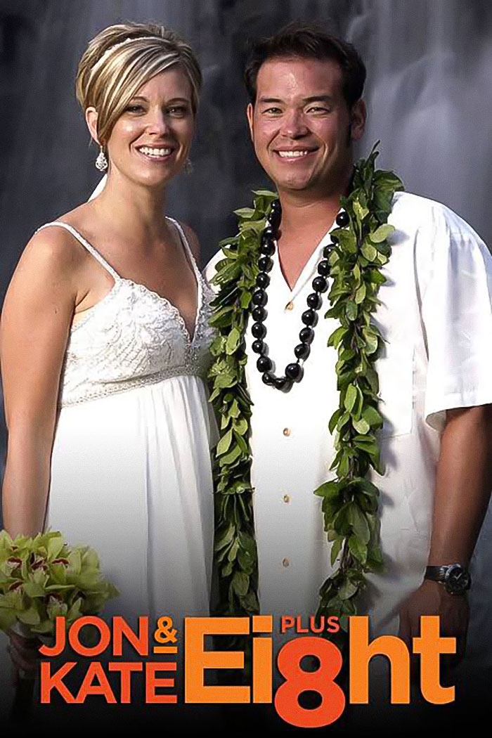 Jon and Kate Gosselin smiling together dressed in wedding attire with Jon wearing a traditional Hawaiian lei and necklace.