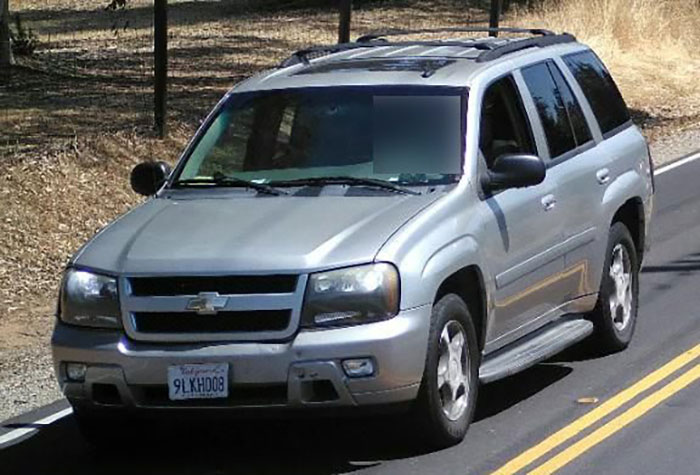 Silver Chevrolet SUV driving on a rural road related to bodies of missing mom and baby found after a month. Silver Chevrolet SUV driving on a rural road related to bodies of missing mom and baby found after a month.