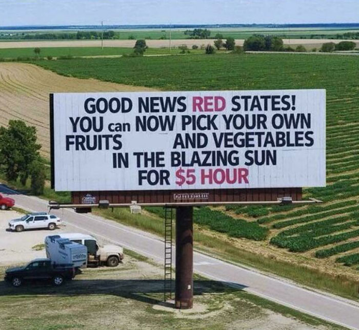 Billboard in a rural area highlighting low-wage farm labor under the blazing sun, reflecting a boring dystopia of modern life.