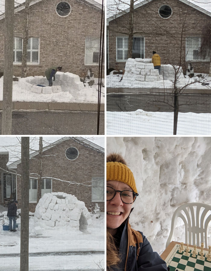 Wholesome kind neighbors building a detailed snow igloo and enjoying a chess game inside the cozy snow structure.