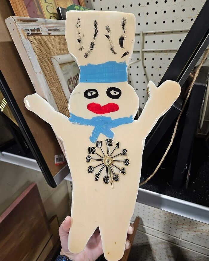Handheld bizarre vintage clock shaped like a chef with painted face found at a thrift store.