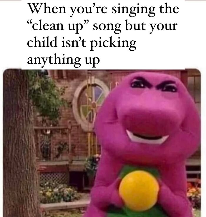 Parenting meme showing Barney the dinosaur with a mischievous face about kids not cleaning up while singing the clean up song.