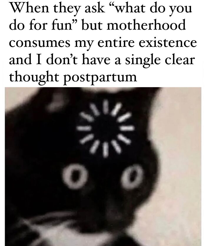 A meme showing a black cat with a loading symbol on its head depicting postpartum motherhood and parenting exhaustion.