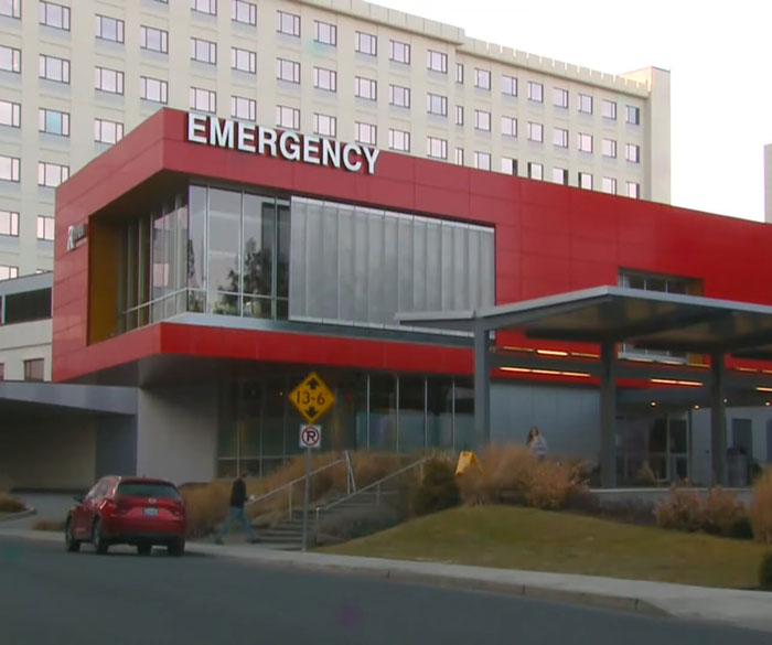 Hospital building with emergency entrance, related to hospital fires involving nurses after patient suicide incident.