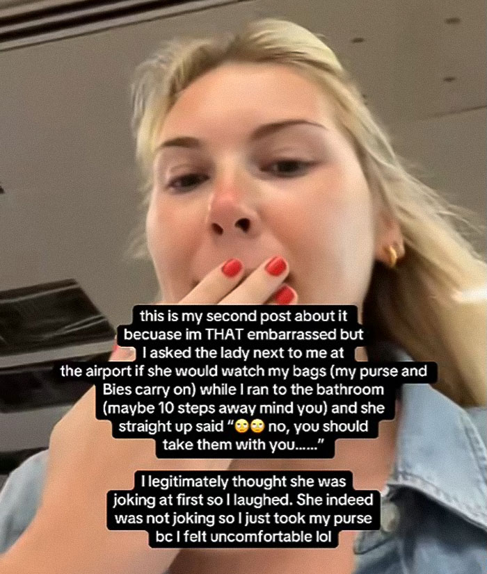 Young woman reacting in airport during heated debate after passenger slams her for refusing to watch bags briefly. Young woman reacting in airport during heated debate after passenger slams her for refusing to watch bags briefly.