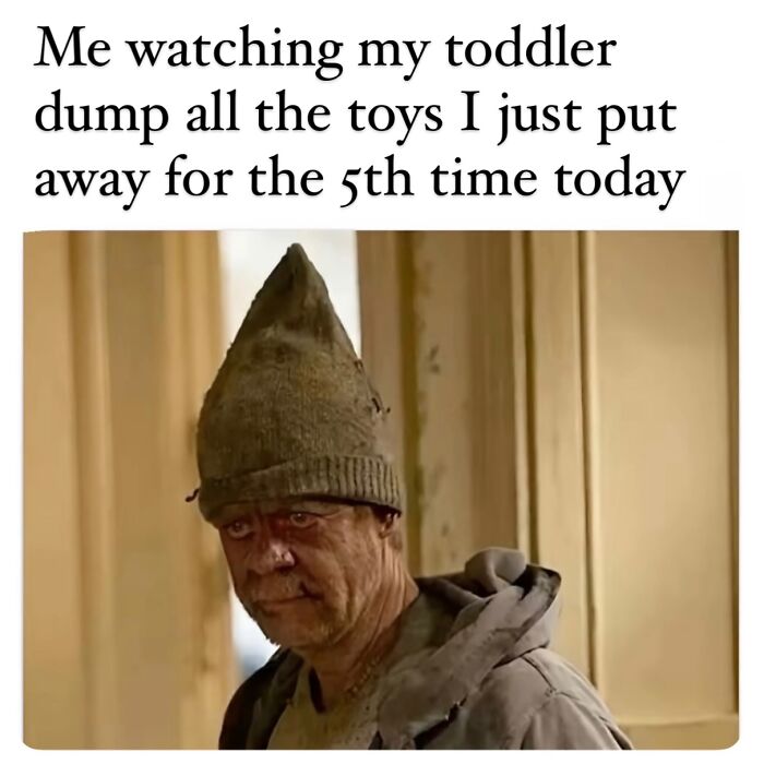 Tired parent watching toddler dump toys for the fifth time, capturing the reality of being a cool mom in parenting memes.