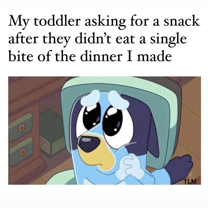 Toddler asking for a snack after refusing dinner, capturing a relatable moment of being a cool mom in parenting.
