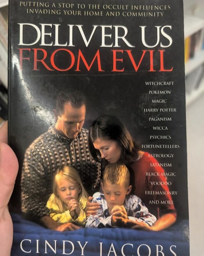 Book titled Deliver Us From Evil about occult influences found at thrift stores with a praying family on the cover.