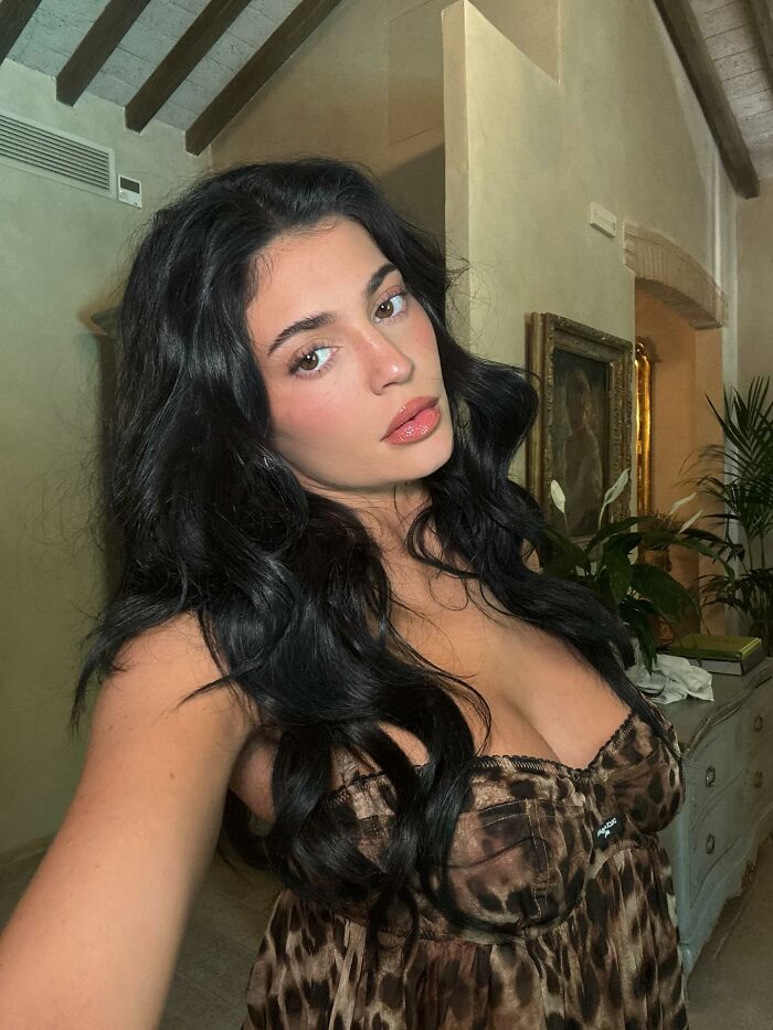 Young woman with long dark hair taking a selfie indoors, relevant to Timoth&eacute;e Chalamet shares bizarre post on Kylie Jenner birthday.