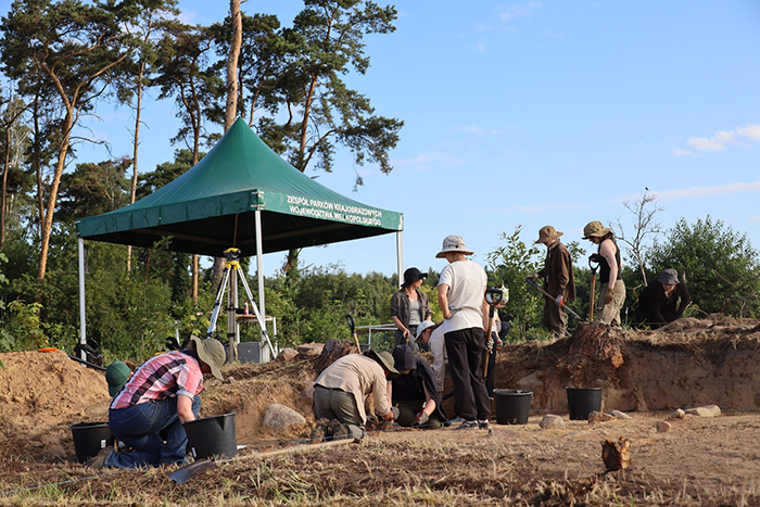 Archaeologists excavating an ancient pyramid site in Poland, uncovering structures older than Egyptian pyramids. Archaeologists excavating an ancient pyramid site in Poland, uncovering structures older than Egyptian pyramids.