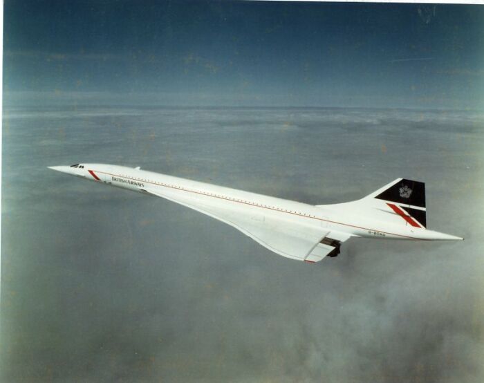 British Airways Concorde supersonic airplane flying above the clouds, showcasing record-breaking invention speed technology.