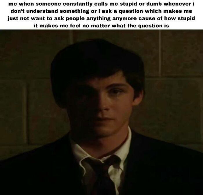 Teen boy in a dark room looking sad, relatable meme about feeling stupid when neurodivergent people get misunderstood.