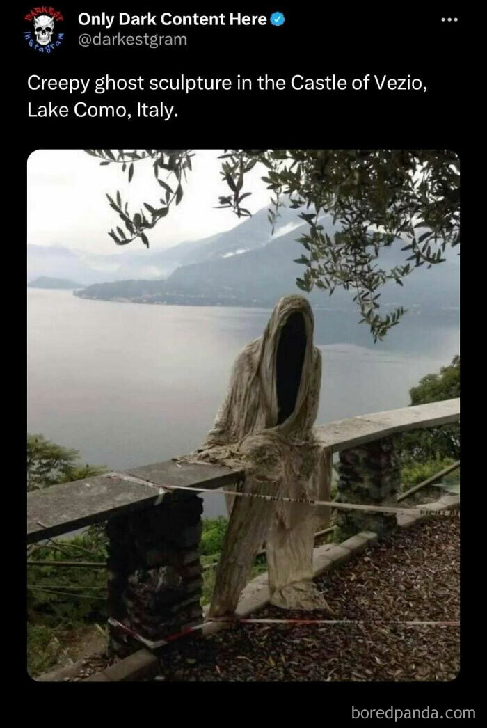 Creepy ghost sculpture at Castle of Vezio overlooking Lake Como, featured on darkest page on Instagram for spooky content.