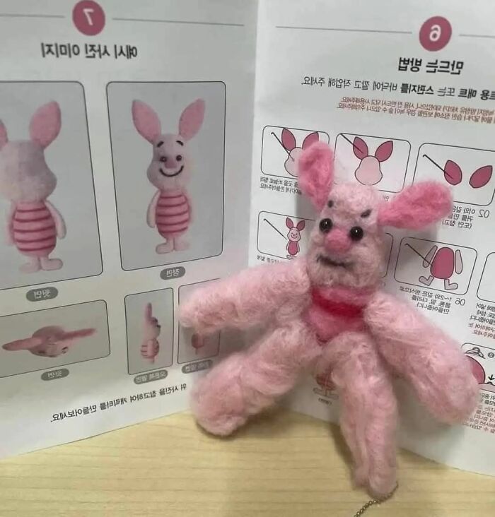 Crooked handmade pink bunny craft with oversized limbs sitting beside its original DIY project instructions.