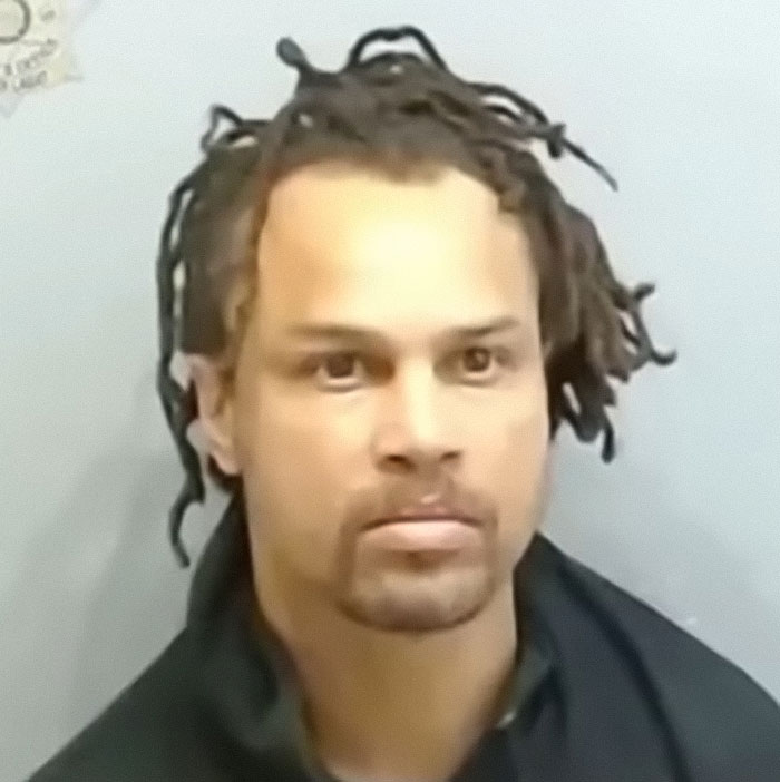 Mugshot of a man with dreadlocks wearing a dark jacket, related to Cincinnati mob attack on single mom incident. Mugshot of a man with dreadlocks wearing a dark jacket, related to Cincinnati mob attack on single mom incident.