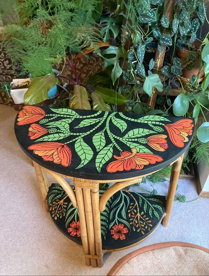 Decor piece featuring hand-painted floral design on a bamboo half-moon table enhancing magical home decor.