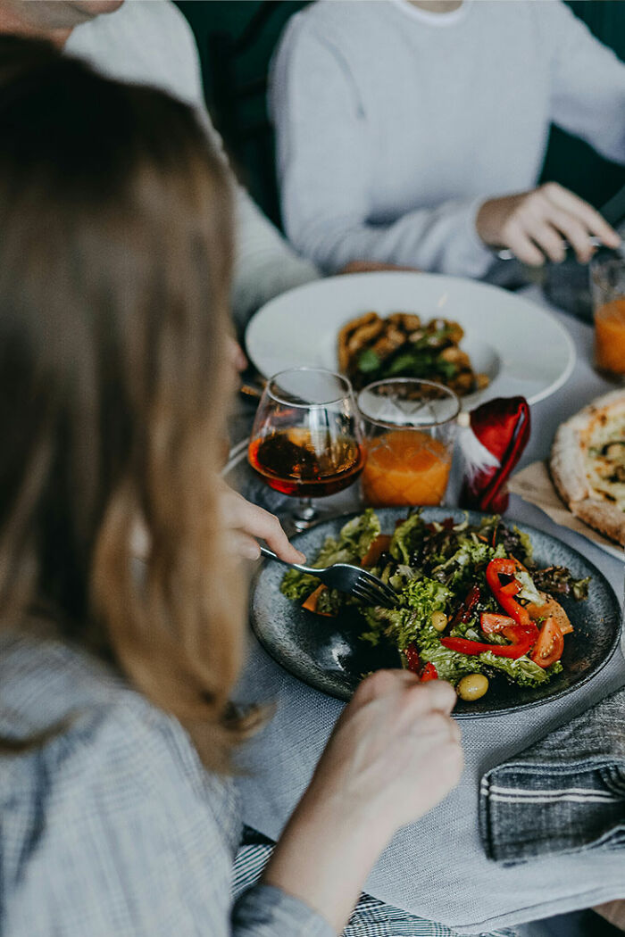 Person eating a healthy salad, illustrating a tiny habit that could help prevent heart attack and dementia.