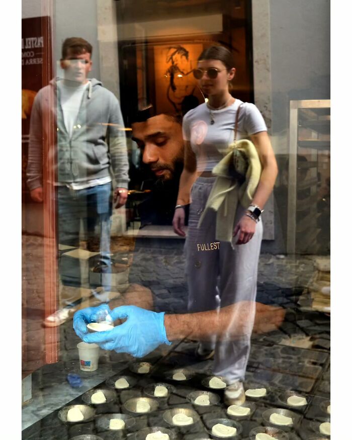 Candid street moments showing people walking and a close-up of hands preparing food, captured by photographer Gerhard Wagner.