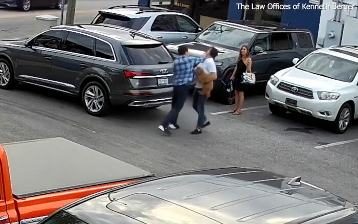 Uber driver confronts CEO in parking lot, with service dog visible during shocking altercation caught on video.