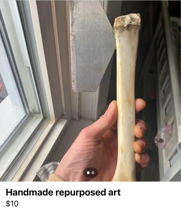 Hand holding a handmade repurposed art bone, an example of horrendous DIY projects craft shaming collection.