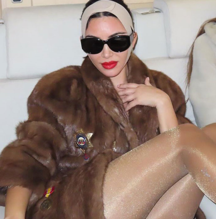 Kim Kardashian wearing a fur coat and sheer shimmery tights in a controversial looks like diaper Skims campaign. Kim Kardashian wearing a fur coat and sheer shimmery tights in a controversial looks like diaper Skims campaign.