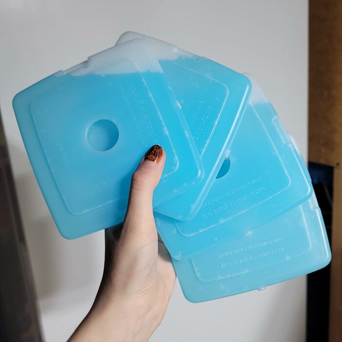 Hand holding several blue reusable ice packs featured in Amazon best seller list products worth the hype.