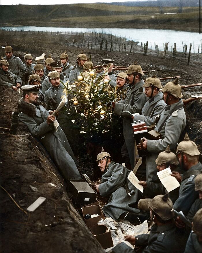 World War I soldiers in a trench celebrating with a decorated Christmas tree showing unfamiliar parts of history.