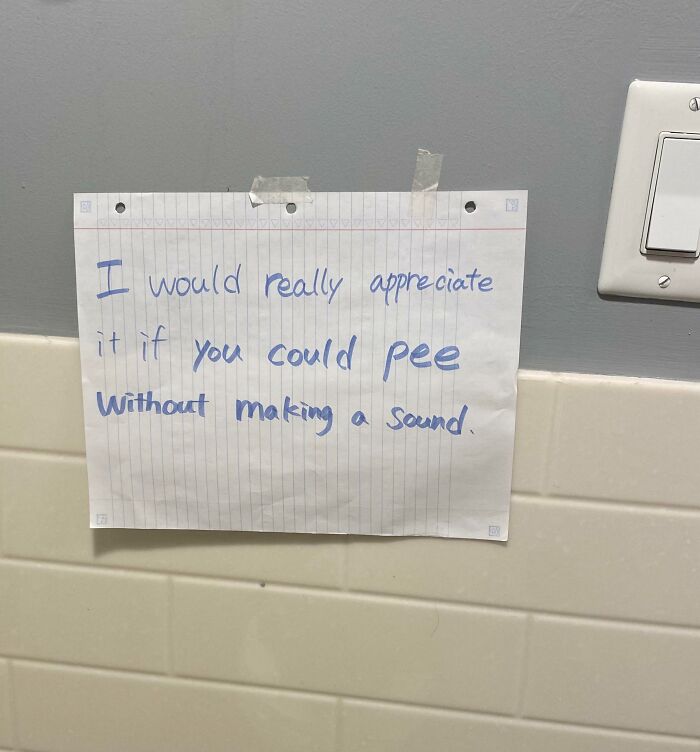 Note on bathroom wall requesting neighbors to pee without making a sound, showing unhinged neighbors’ notes humor.