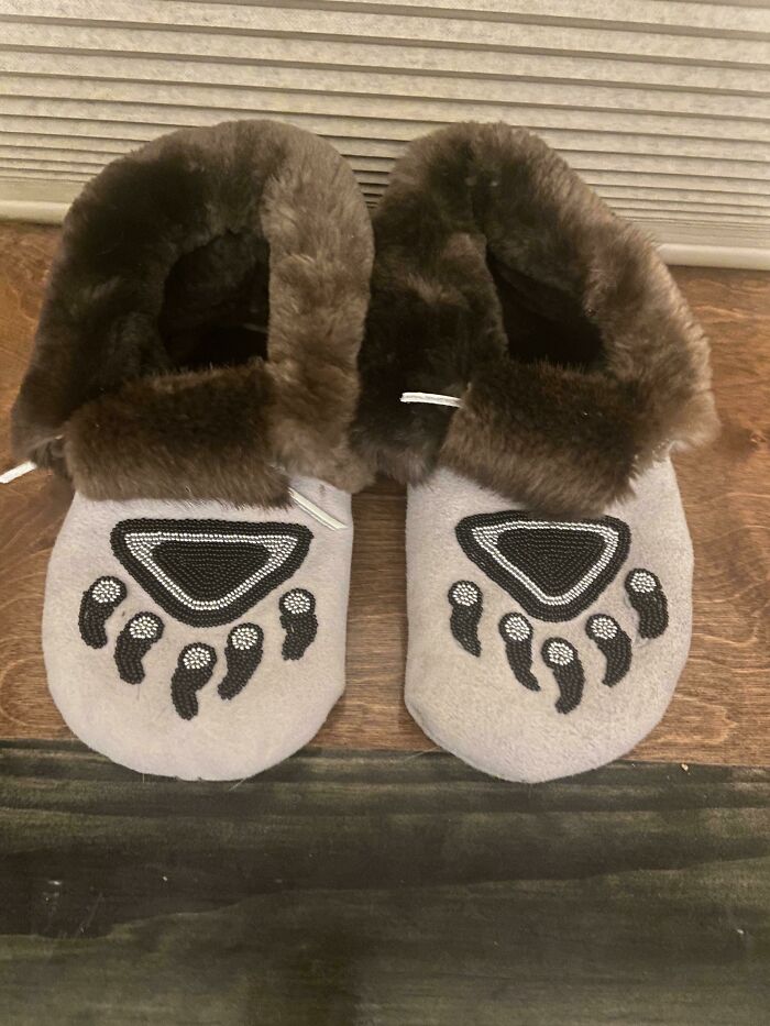Pair of fur-lined slippers with paw print designs, one of the weirdest things seen in someone else's home. - 18