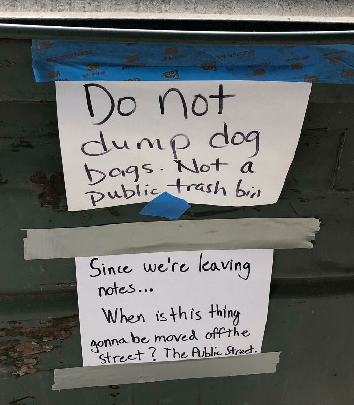 Handwritten unhinged neighbors’ notes taped to a dumpster warning against dumping dog bags and asking when it will be removed.