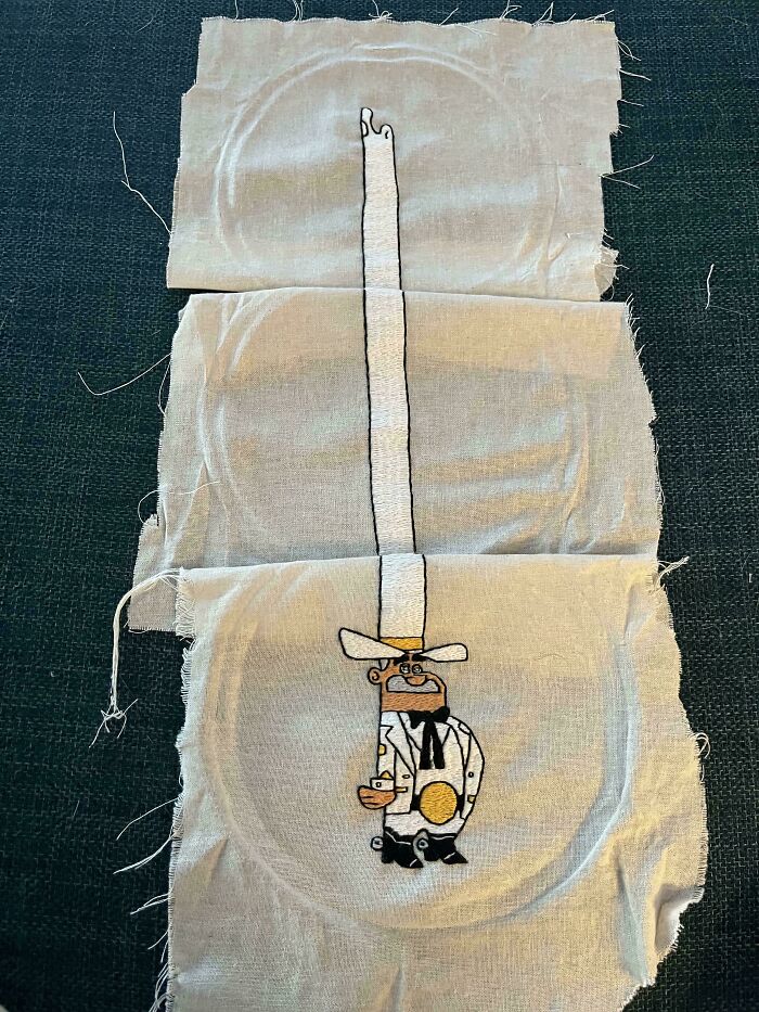Embroidered fabric showing a cartoon cowboy character with a tall hat, demonstrating incredible and beautiful embroidery skills.