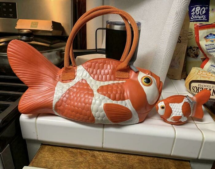 Fish-shaped bags in orange and white, showcasing examples of awful taste but great e*******n in design and humor.