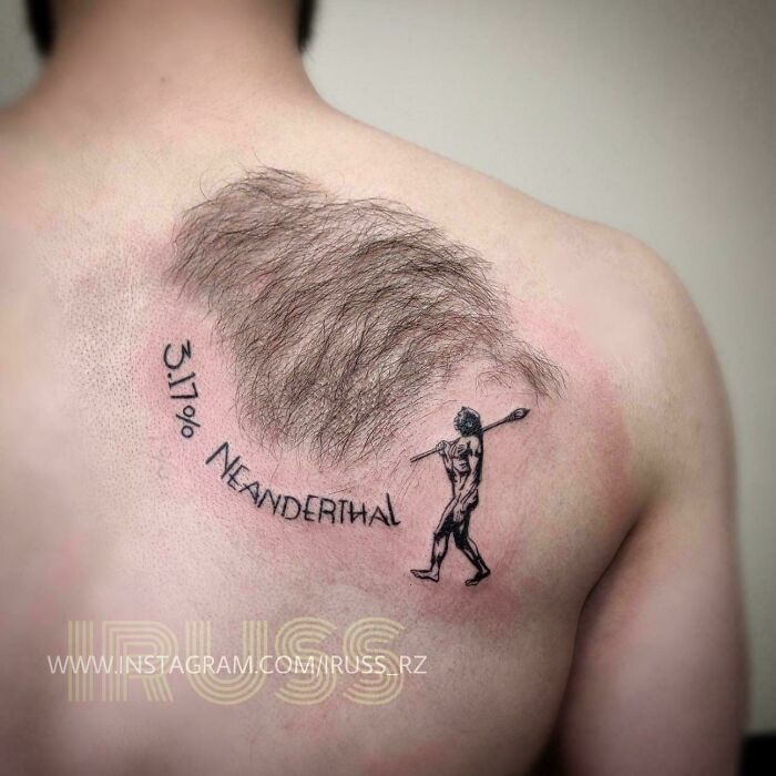 Tattoo on back featuring realistic chest hair as a club with a caveman, showing awful taste but great e*******n.