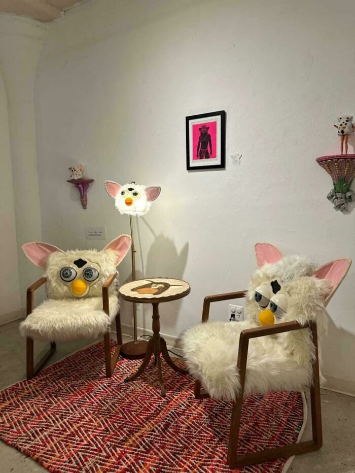 Two chairs and a lamp with Furby-inspired design in a room, showcasing examples of awful taste but great e*******n.