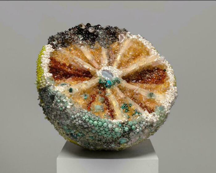 Beaded citrus fruit sculpture showcasing awful taste but great e*******n in a unique and detailed art piece.