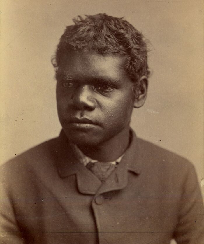Portrait of Indigenous Australian man from the 1900s, showcasing rare glimpses into early Indigenous Australian life.